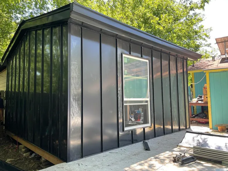 Black standing seam metal wall panels for Metal Roof Installation in Pennfield