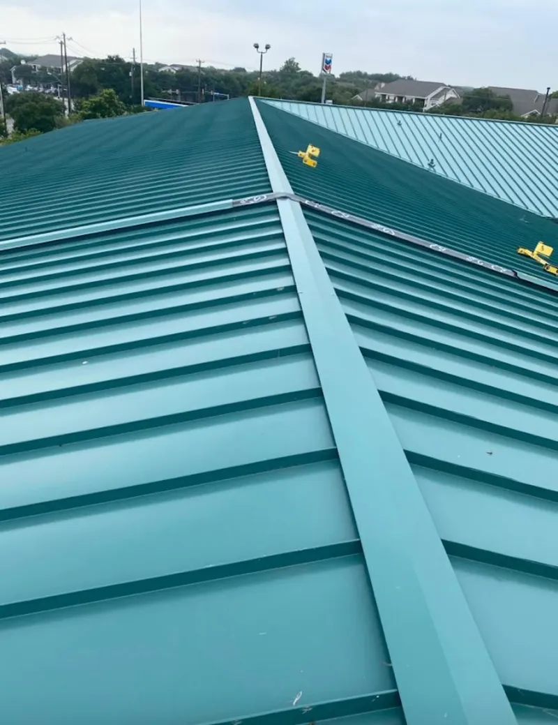 Green commercial metal roof ridge and valley for Metal Roof Repair in Pennfield